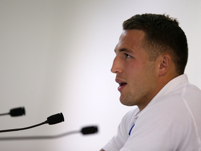 Sam Burgess talking to media